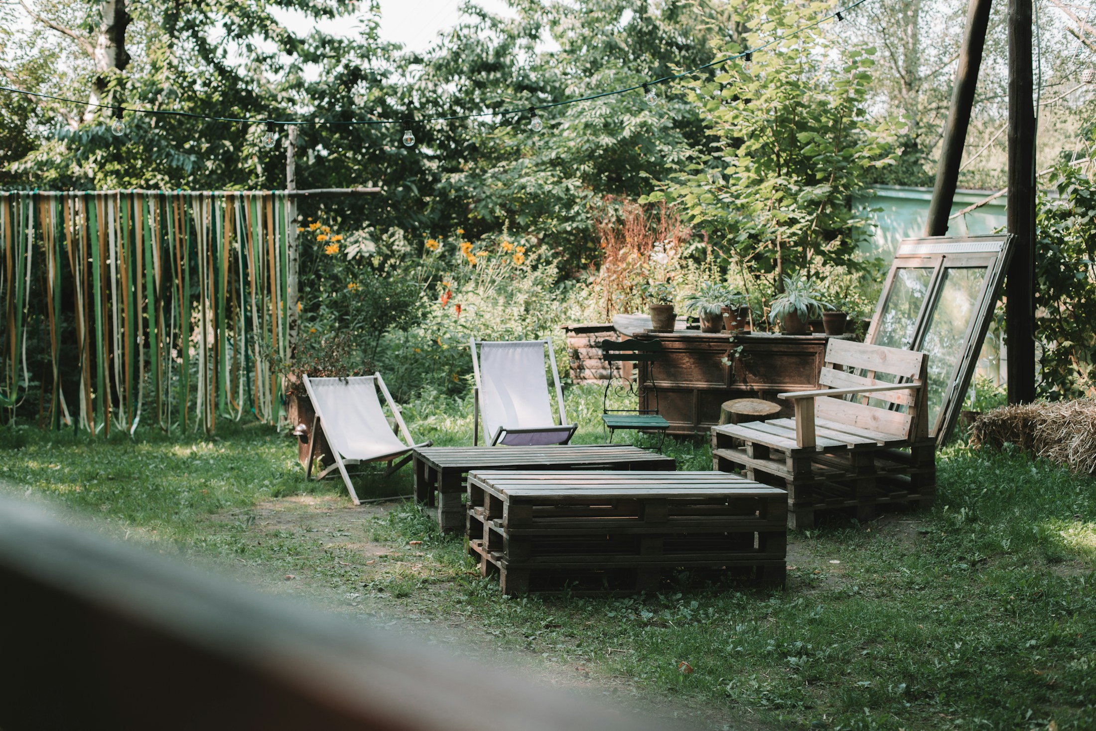 Outdoor timber seating and pallet furniture setting