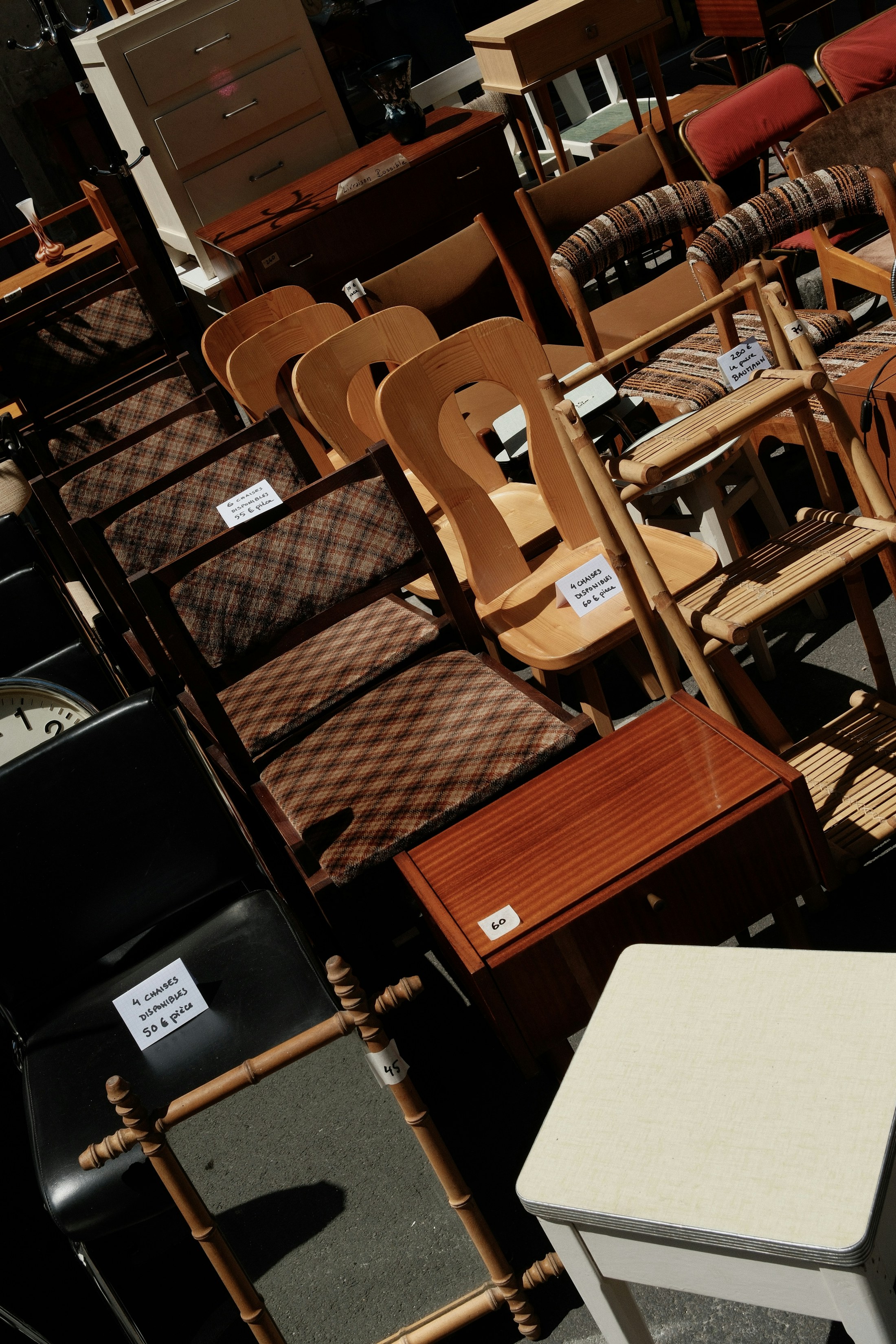 Rows of chairs and small tables available for selection
