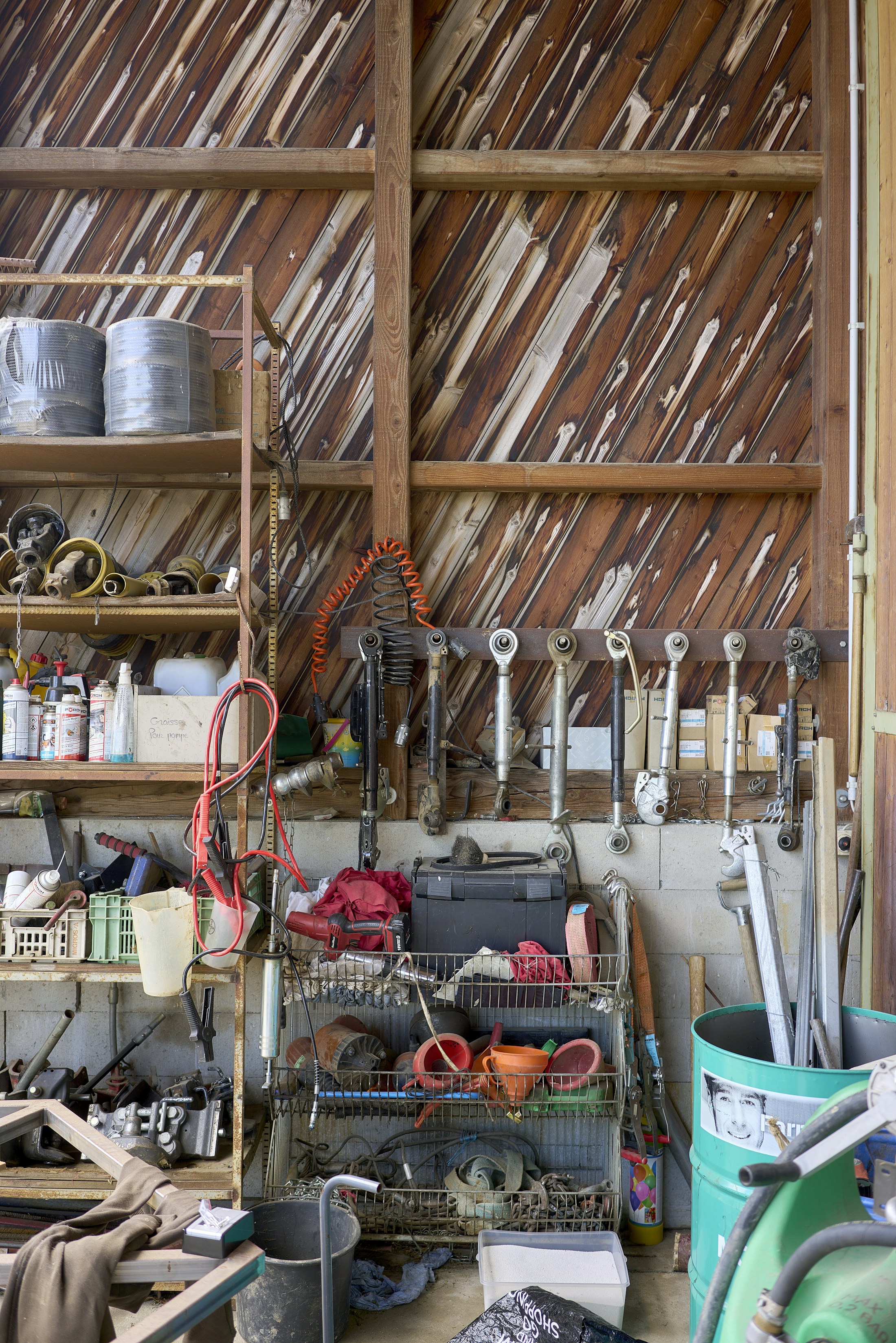 A wooden work table with tools in a workshop